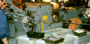 adjusting centerless grinder.jpg (29310 bytes)